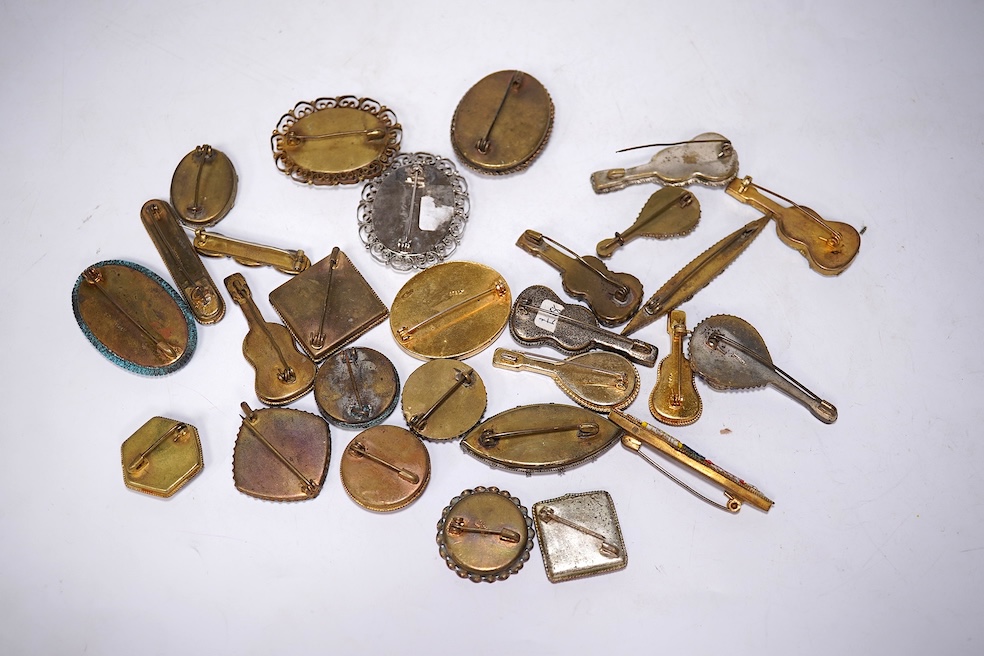 A collection of twenty-eight micro-mosaic brooches, including ten banjo and guitars shaped brooches, six similar large oval brooches, nine small brooches and three long brooches. (28) Condition - good